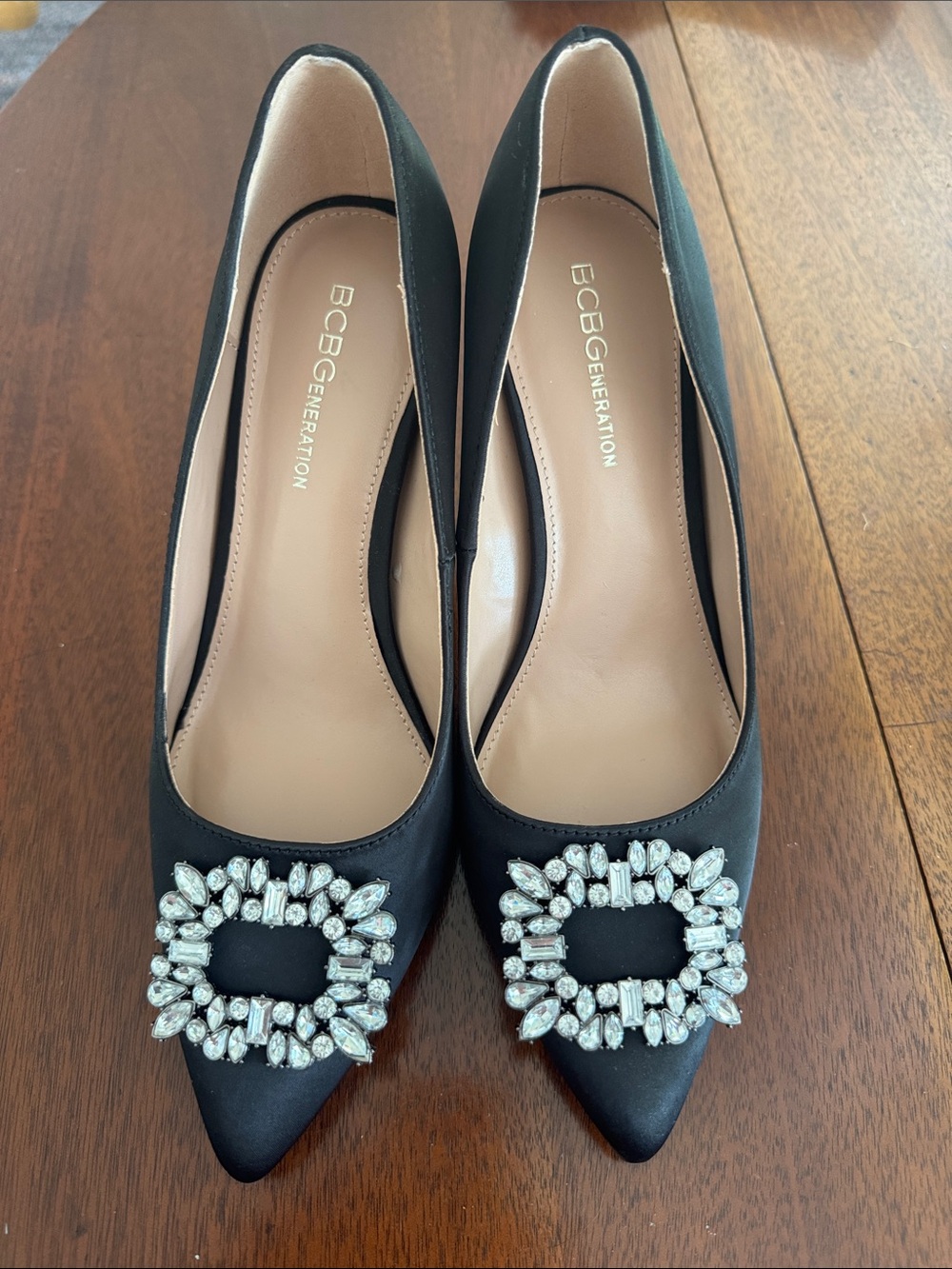 BCBGeneration Black Satin Pointed Toe Pumps with Crystal Brooch
